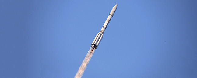 Proton rocket climbing away at an angle following launch