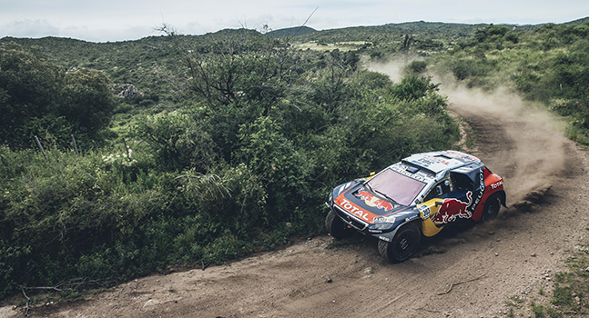 Car crossing scrubland on the Red Bull Dakar Rally