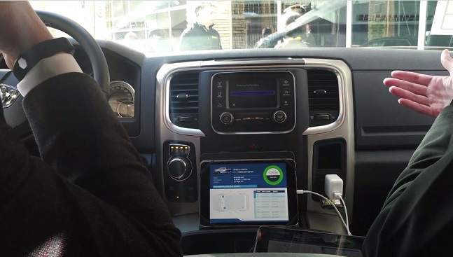 Mockup of a console in the vehicle showing an over the air update happening 