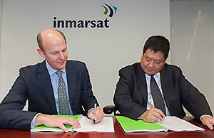 L-R: Inmarsat CEO, Rupert Pearce, and MCN Vice President of Sales & Marketing, Mr. Song Zhen, MCN signing the agreement