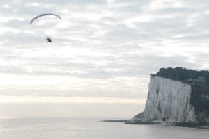 Sacha in her paramotor close to the cliffs near Dover