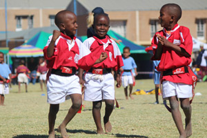 Young children playing rugby in Africa 