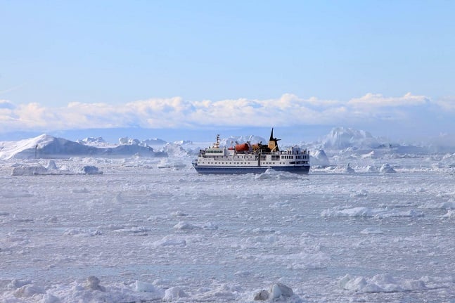 The adventure cruise ship Ocean Nova moving through ice