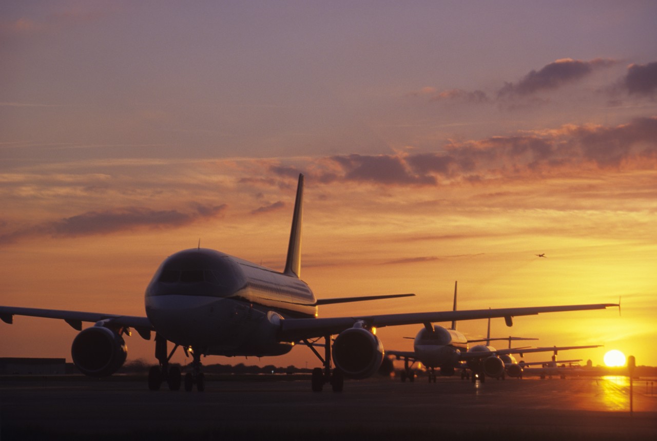 Mandatory Credit: Photo by Kevin Phillips/Mood Board/REX/Shutterstock (1259197a)
Planes Sitting on Tarmac at Sunset
Industrial