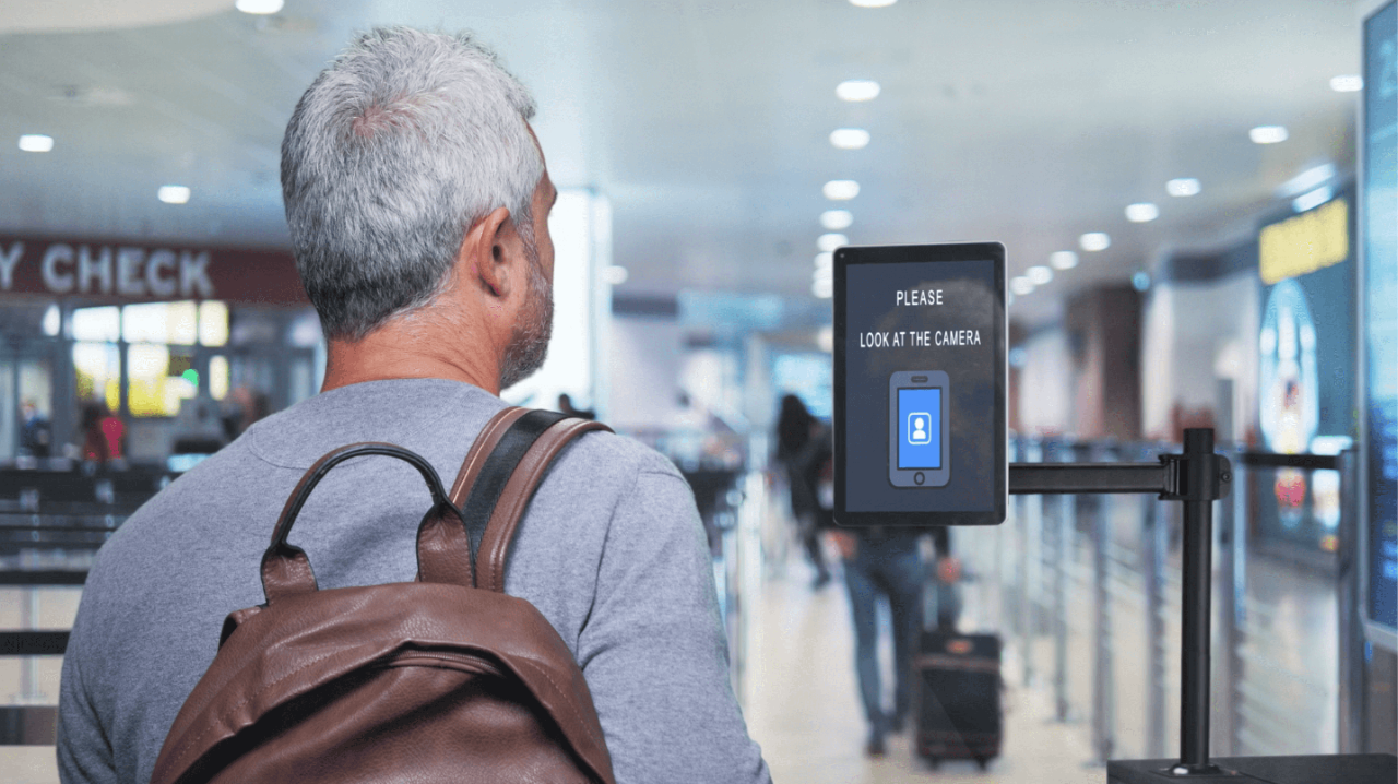 Man walking through airport with facial recognition to provide contactless experience
