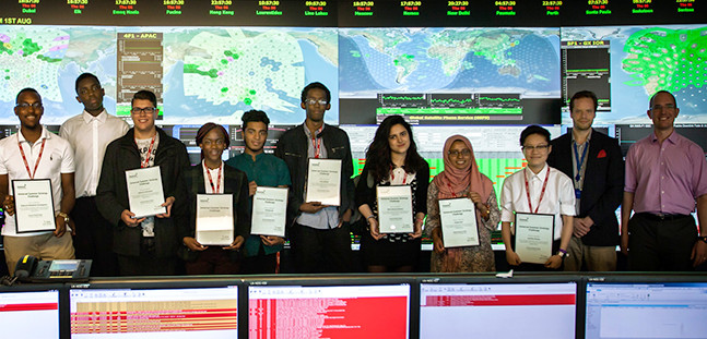 Students receiving their certificates after a week of work experience for STEM students at Inmarsat