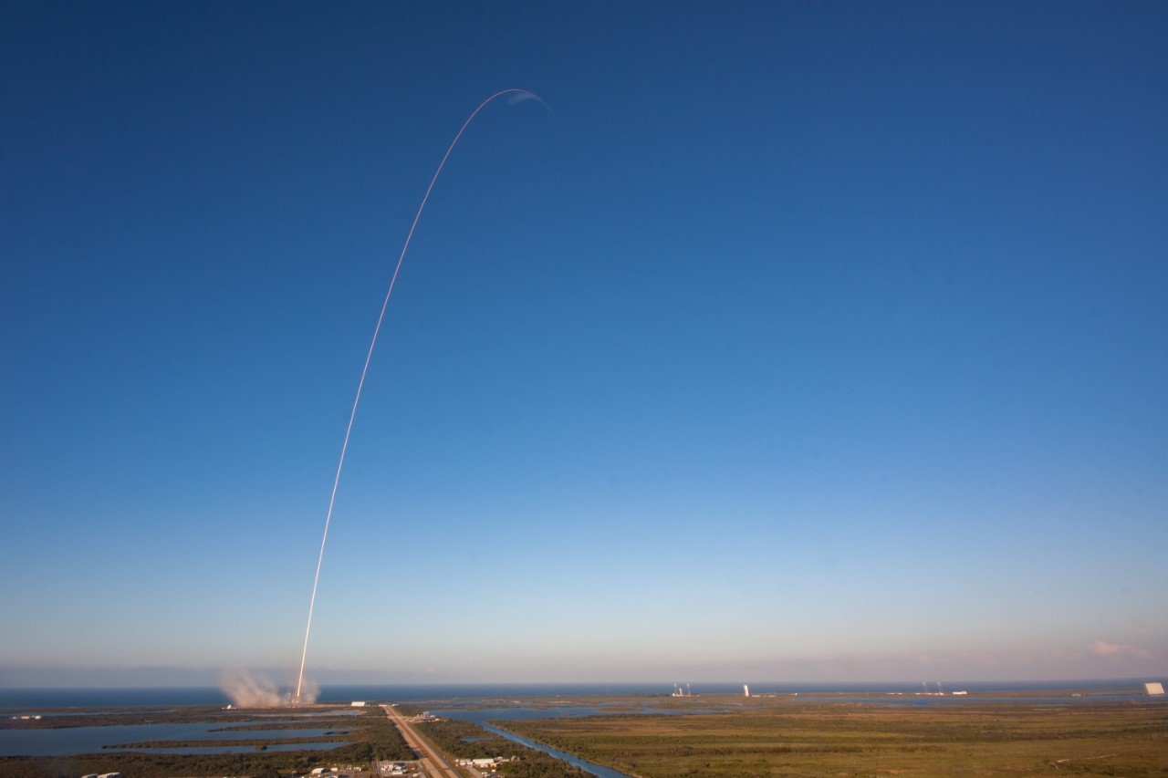 Falcon 9 rocket arcing away from the launch site carrying GX4