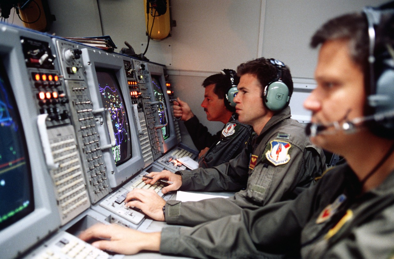 US Air Force weapons control officers onboard an E-3 Sentry Airborne Warning and Control System (AWACS) aircraft prepare for a mission over Turkey in support of the operation.  This operation is a security mission to enforce the United Nations no-fly zone north of the 36 degree parallel from Iraqi air and ground incursion.  A four nation coalition of US, Turkey, Great Britain and France has been actively protecting and supplying Kurdish refugees since Desert Storm in 1991.