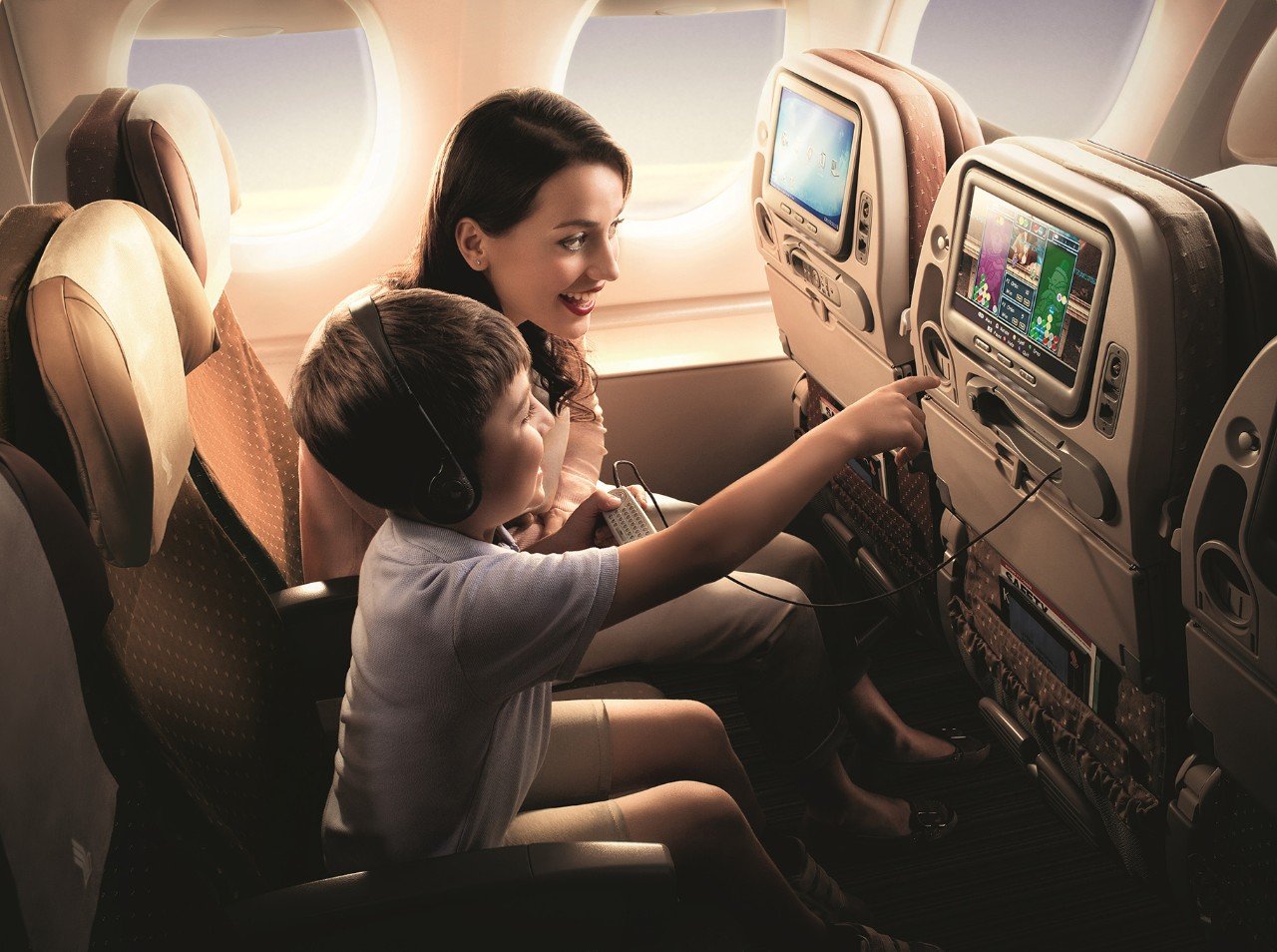 Artist's impression of Singapore Airlines A380 interior with family using IFE
