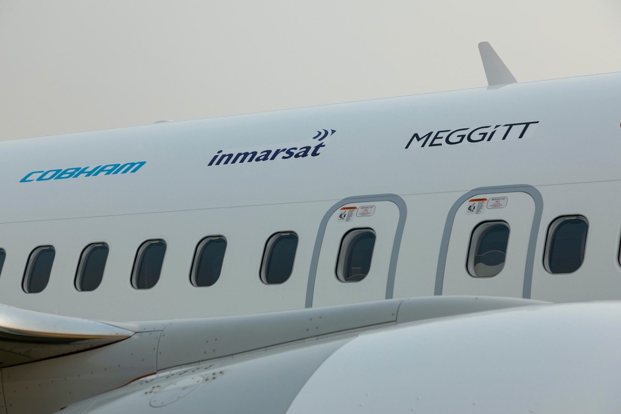 Close up of the 737-9 fuselage with Inmarsat and other partner's logos.