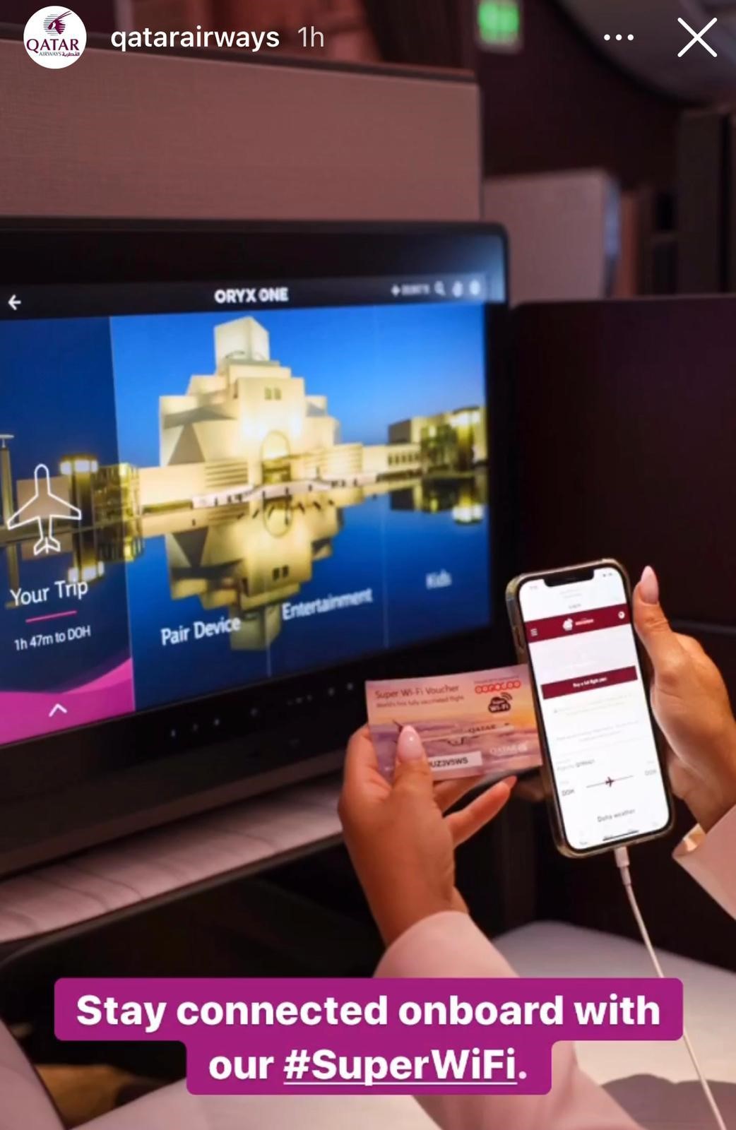 A mobile phone and desktop being used onboard the Qatar Airways flight