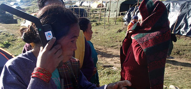 Nepalis using Inmarsat satphones following TSF's deployment to the region