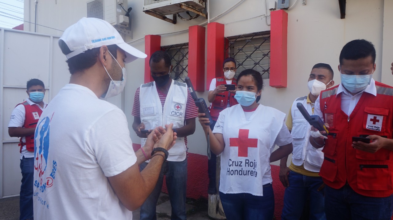 The red cross team of men and women in Honduras receiving training on Inmarsat IsatPhone 2 handheld satellite phones by TSF