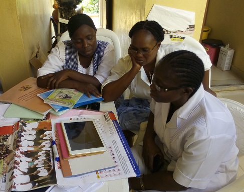 Female health workers in Nigeria watching training videos