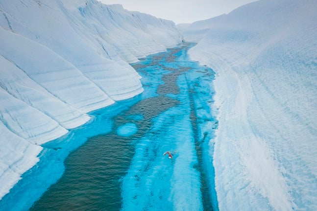 Lewis Pugh swimming the newly formed supra glacial river in Antarctica