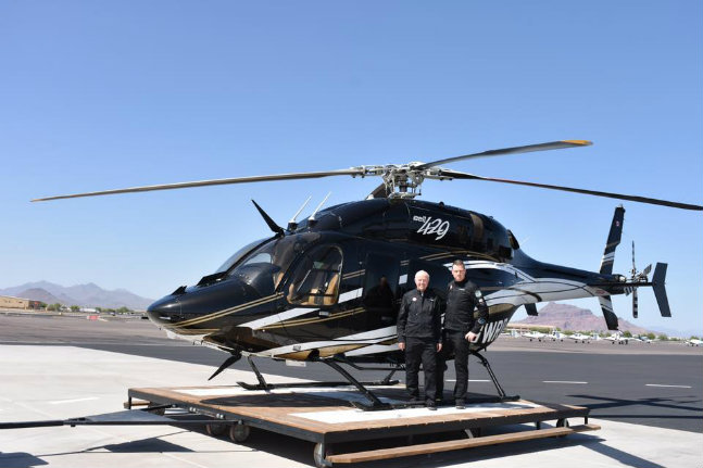 Bob and Steven Dengler with their helicopter they will use for their round the world trip to celebrate 150 years of Canada