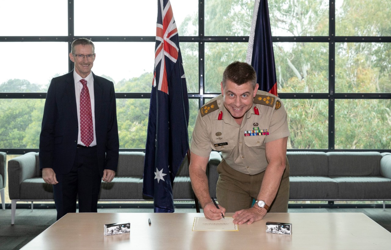 L-R: President Global Government Inmarsat Todd McDonell and Commander Defence Strategic Communications Brigadier Gregory Novak at the Defence Network Operations Centre, HMAS Harman, Australian Capital Territory