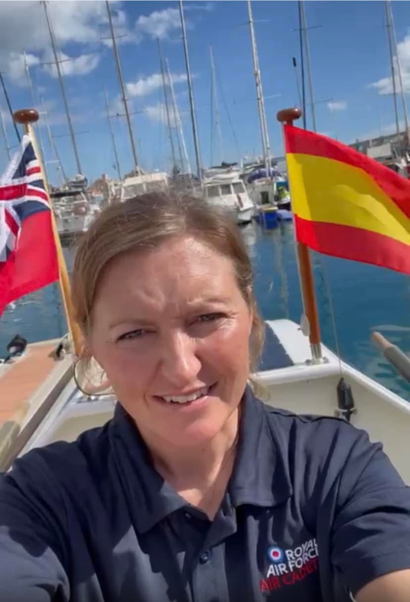 Atlantic rower takes a selfie sitting in her boat in a harbour
