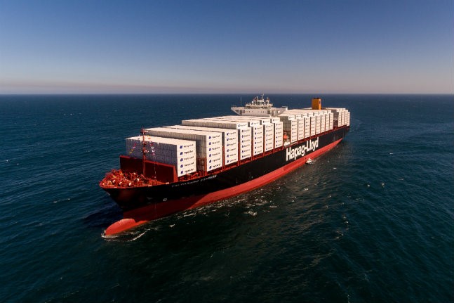 Hapag Lloyd vessel sailing on ocean loaded with containers