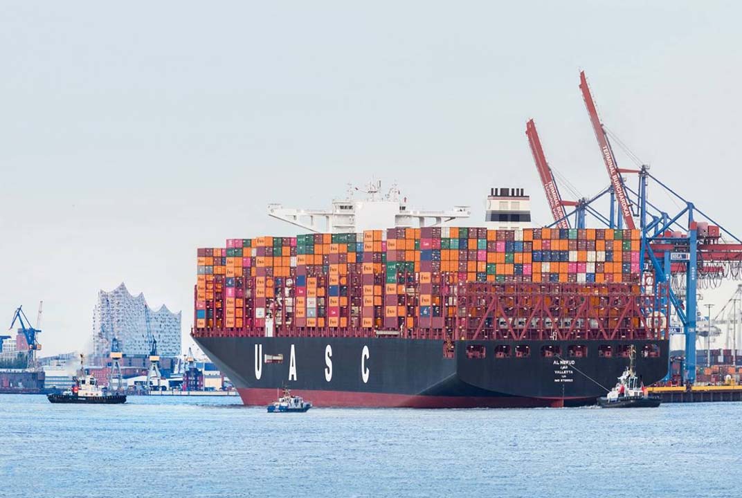 A Hapag-Lloyd container ship sailing in a port