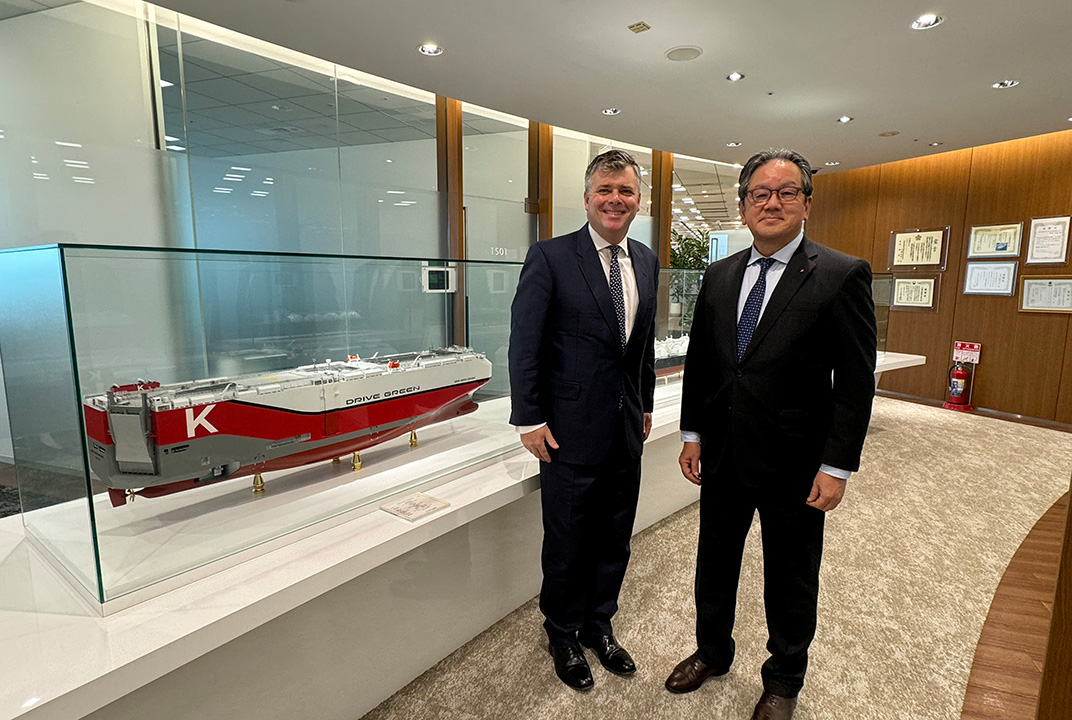 Ben Palmer, President, Inmarsat Maritime & Yukikazu Myochin, President & CEO, “K” LINE standing next to a model of a "K" LINE vessel