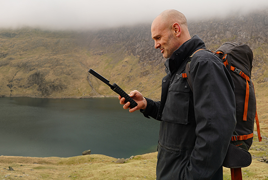 Ed Stafford with an Inmarsat IsatPhone 2